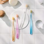 Atomy Toothbrush 4 colors lifestyle flatlay - gold powder antibacterial toothbrush